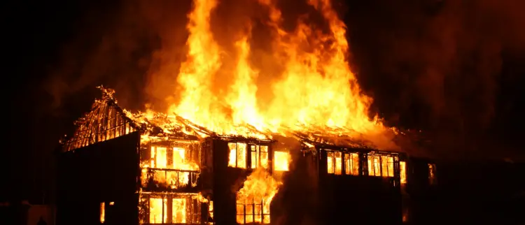 A house on fire that should be insured with an insurance products.